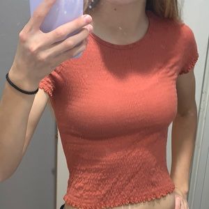 orange robbed american eagle crop top